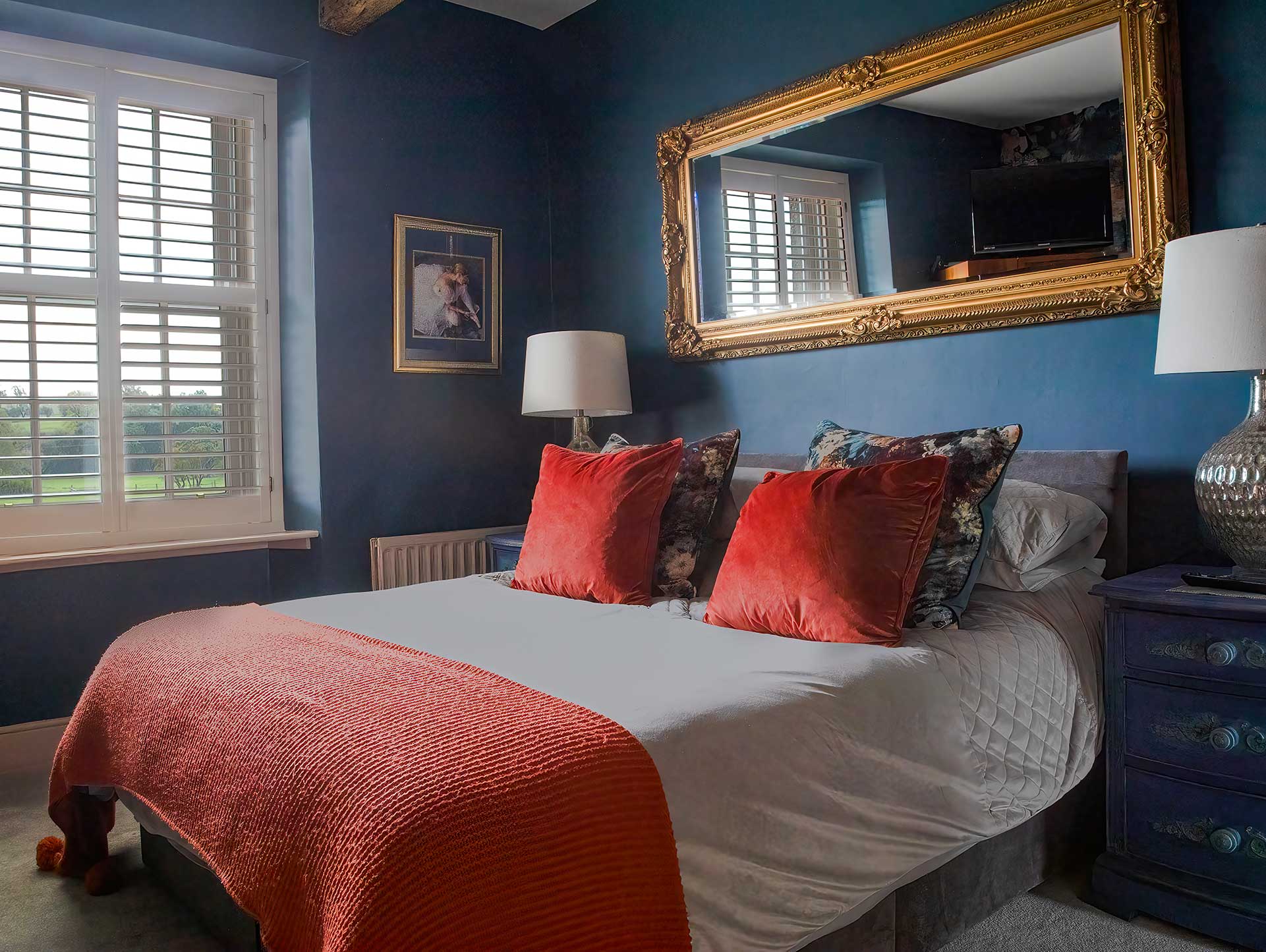 An image of a bedroom with a double bed configuration